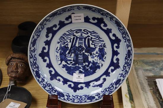 A Chinese blue and white dish, in Kangxi style, wood stand diameter 34cm